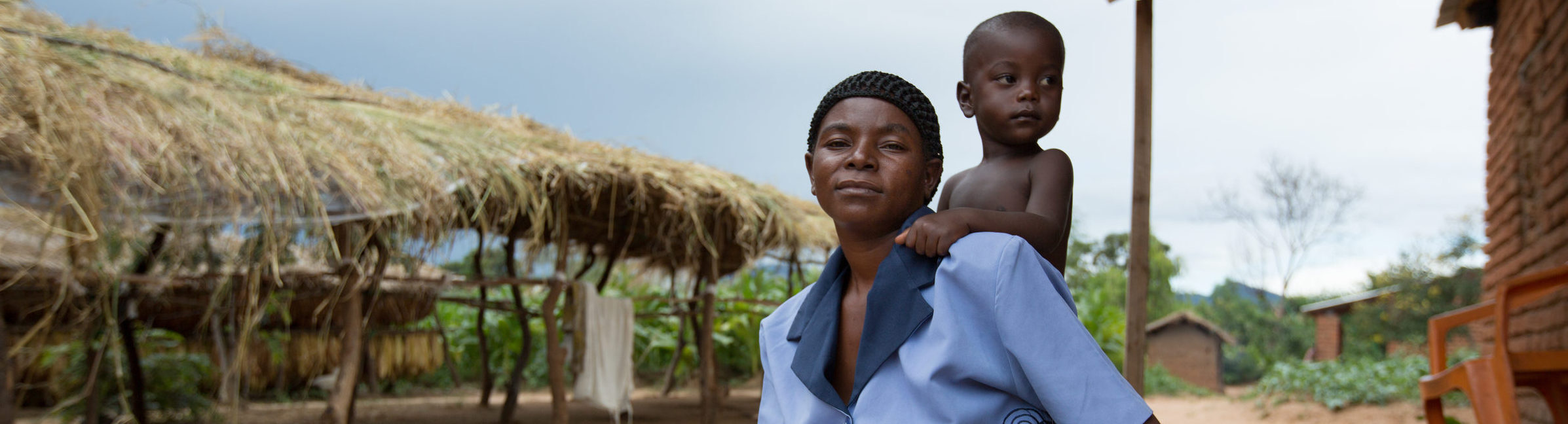 Black woman with a child on her back