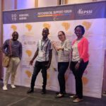 Brian and Gilbert with Team EGPAF on stage at REPSSI