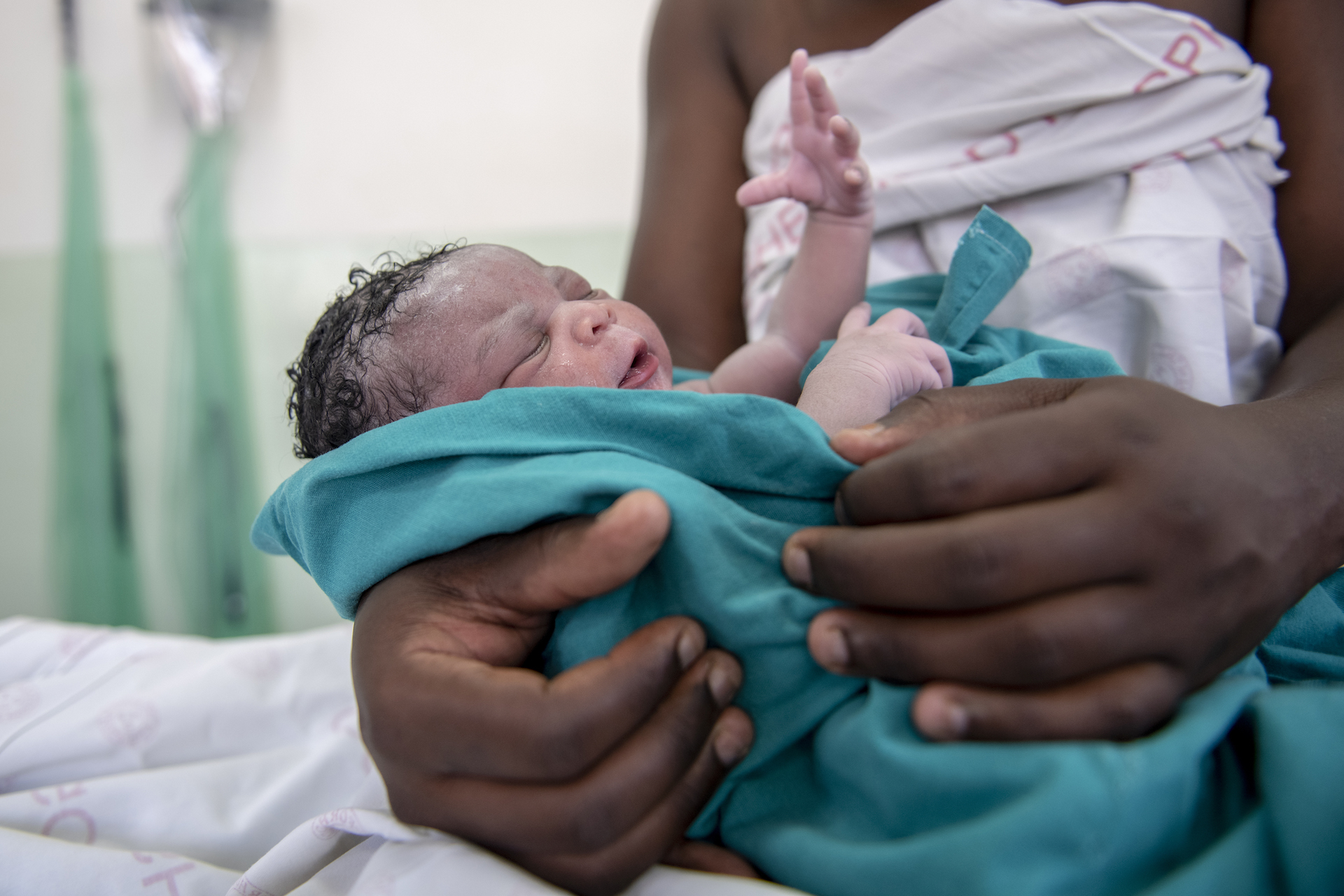 newborn baby held by mother in Eswatini