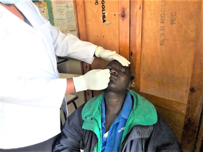 Patrick Muema, is tested for COVID-19 at Ngoliba Health Center one of the Catalytic COVID-19 Action (CCA) study sites. 