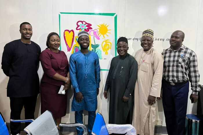 EGPAF Nigeria Program Manager Dr. Nguavese Torbunde poses with Taraba stakeholders at the new youth-friendly center that EGPAF refurbished at General Hospital Zing. 