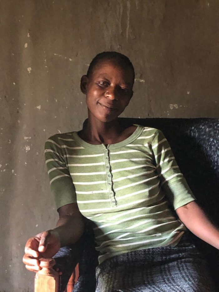 Woman sitting in chair looking at the camera. 