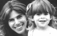 Elizabeth and her young daughter, smiling at the camera.